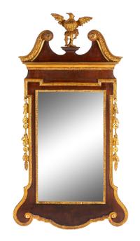 A George III Style Parcel Gilt Mahogany Mirror Height 58 x width 31 inches.