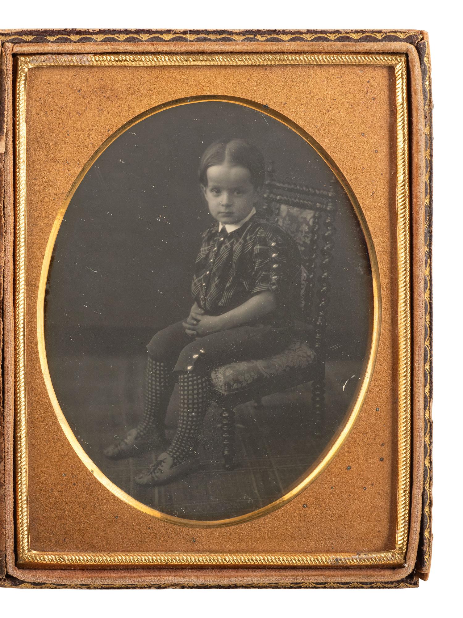 [EARLY PHOTOGRAPHY]. Two quarter plate daguerreotypes of young children posed in studio settings.