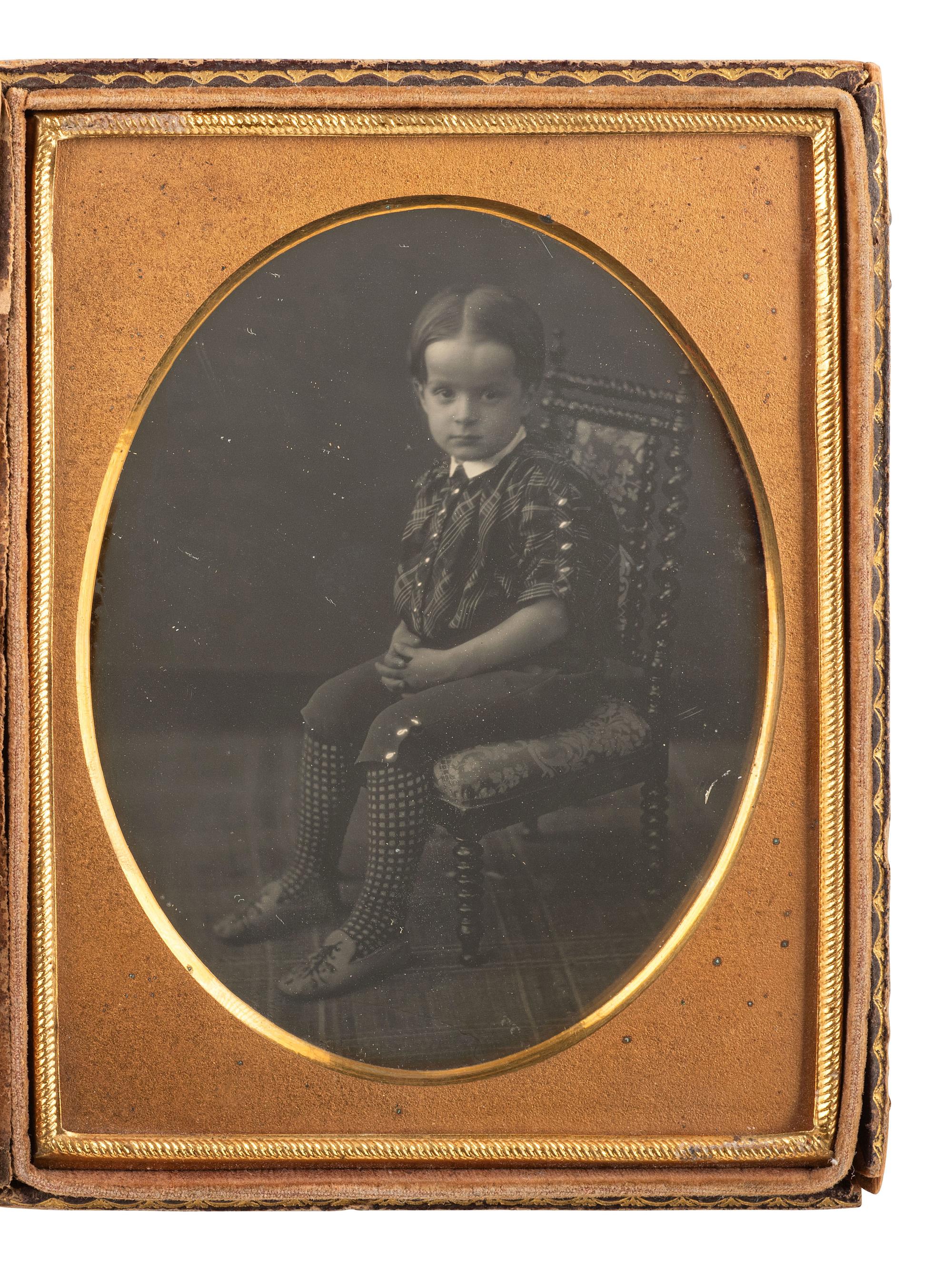 [EARLY PHOTOGRAPHY]. Two quarter plate daguerreotypes of young children posed in studio settings.
