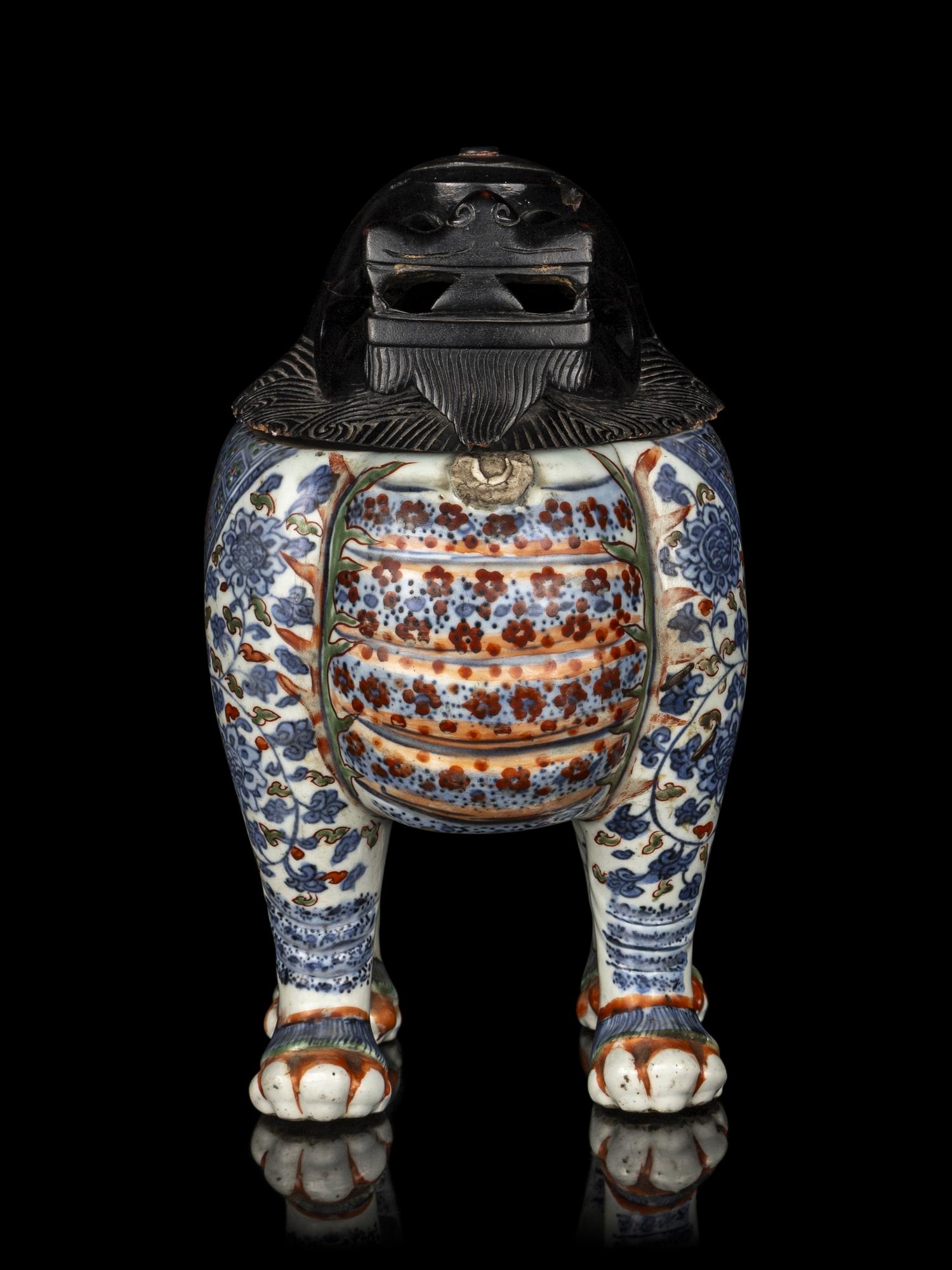 A Chinese Copper Red and Underglaze Blue Porcelain Mythical-Beast Form Incense Burner