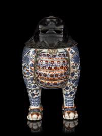 A Chinese Copper Red and Underglaze Blue Porcelain Mythical-Beast Form Incense Burner