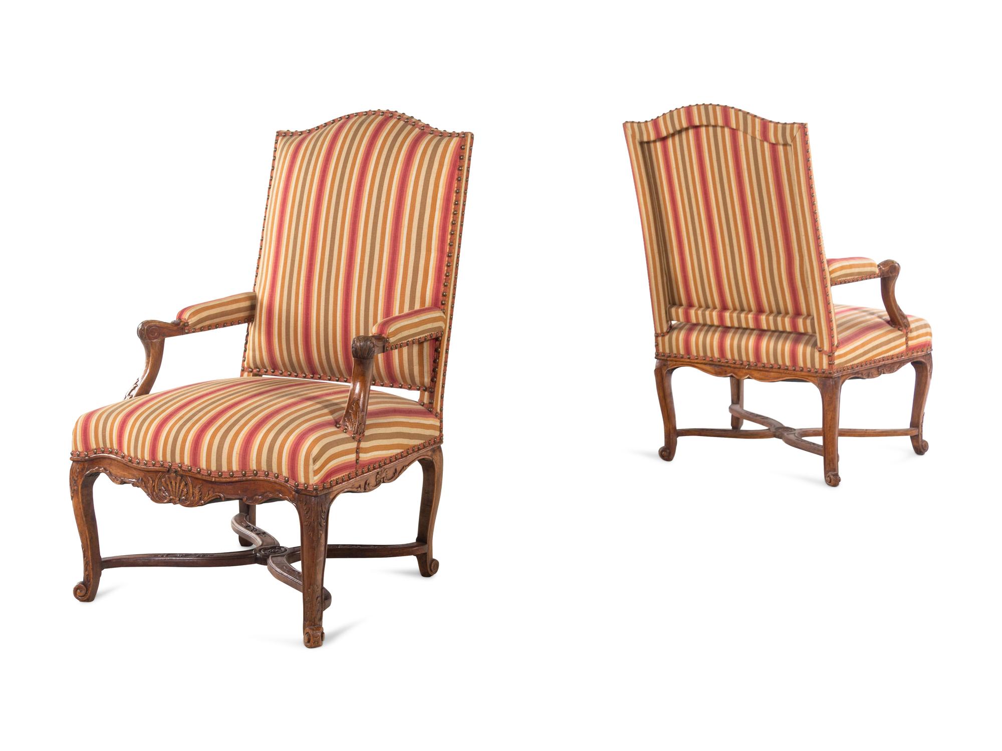A Pair of Régence Carved Walnut Armchairs