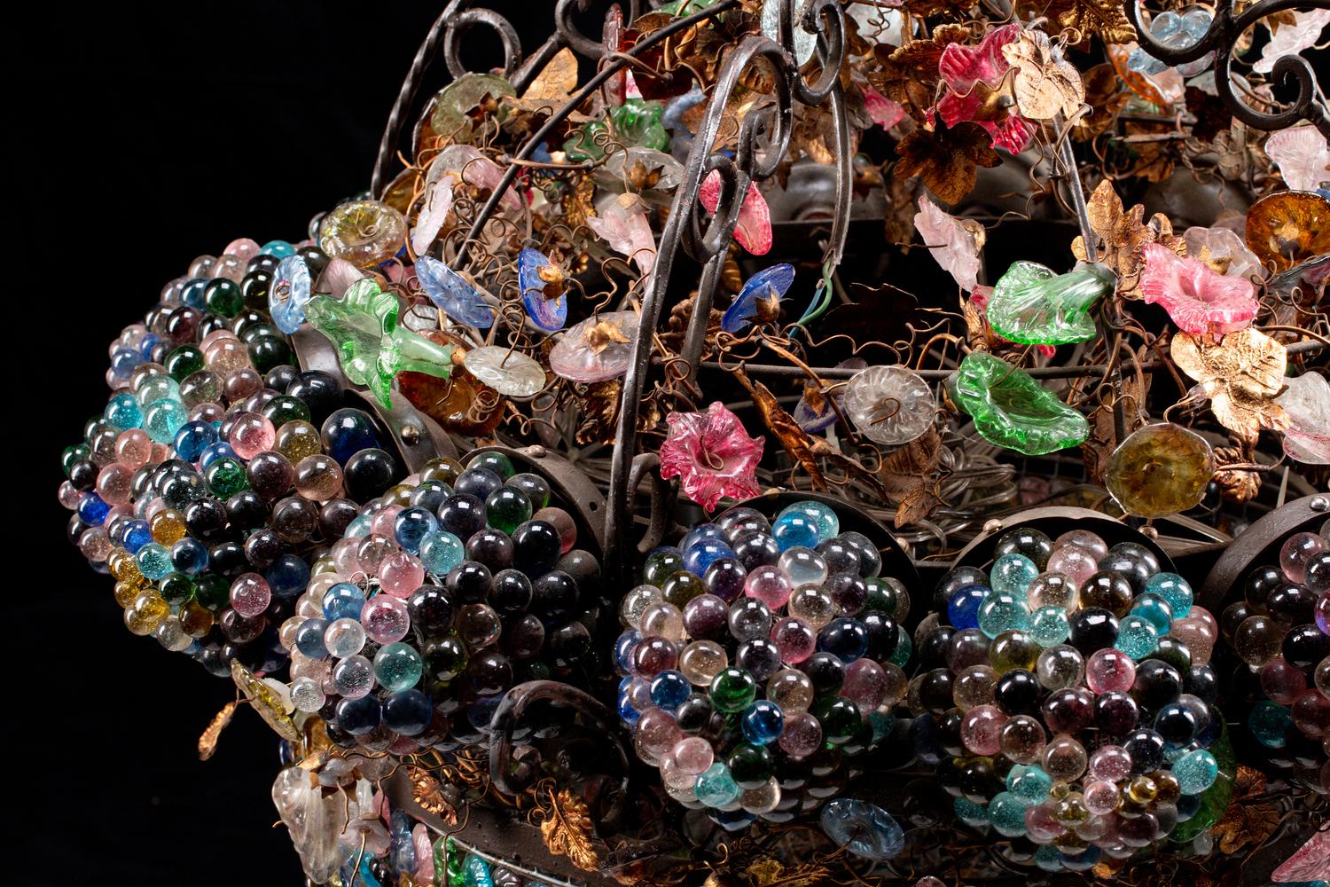 An Unusual Continental Wrought-Iron, Tole and Colored Glass Sixteen-Light Chandelier