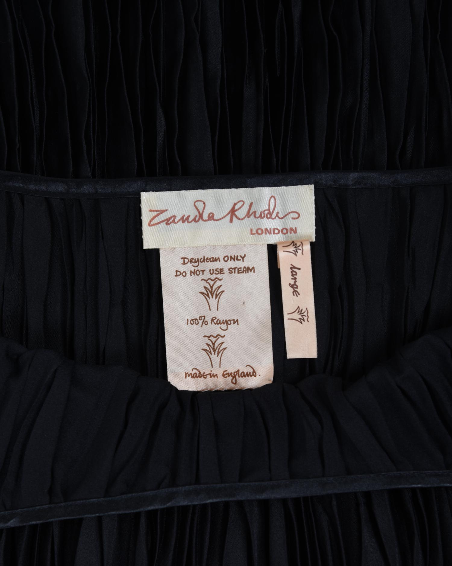 Three Pleated Items: One Zandra Rhodes Bolero and Dress, and One Mary McFadden Dress with Belt, 1980s