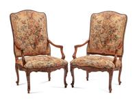 A Pair of Régence Style Carved Walnut and Tapestry-Upholstered Armchairs