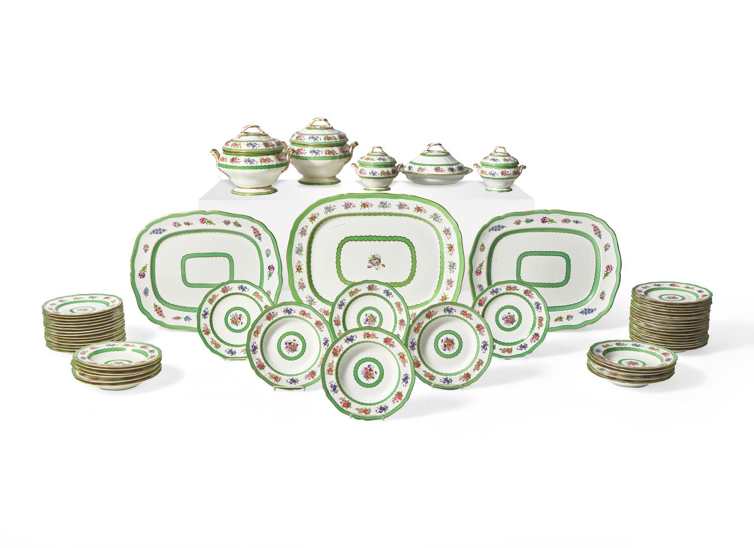 An English Floral Decorated and Parcel Gilt Creamware Dinner Service