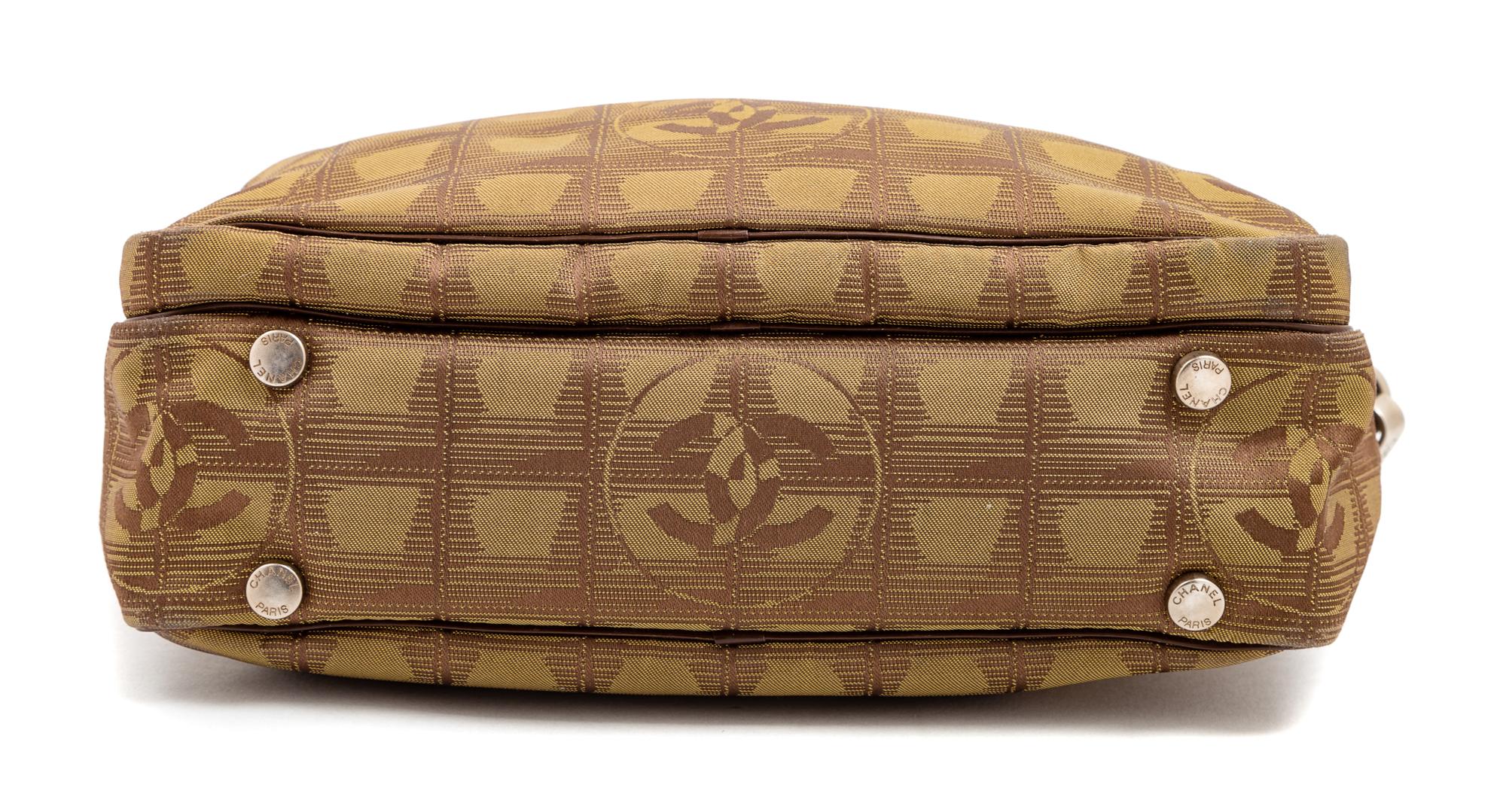 A Chanel Brown Nylon Travel Line Handbag, 8" H x 10" W x 4" D; Handle drop: 4.5".