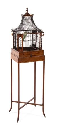 A Victorian Mahogany and Wirework Birdcage, Height overall 51 inches.