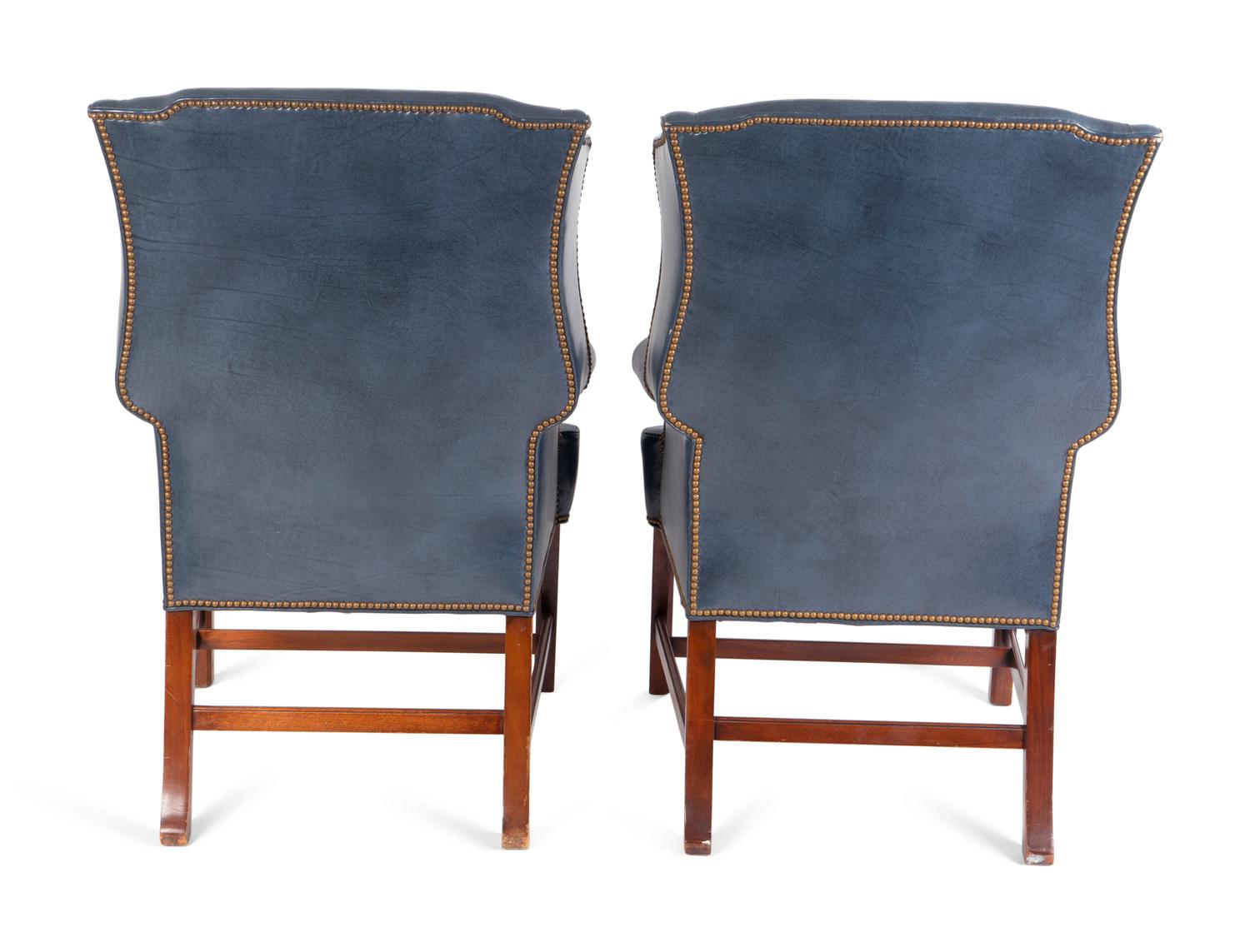 A Pair of George II Style Leather Upholstered Wingback Chairs — 19TH CENTURY