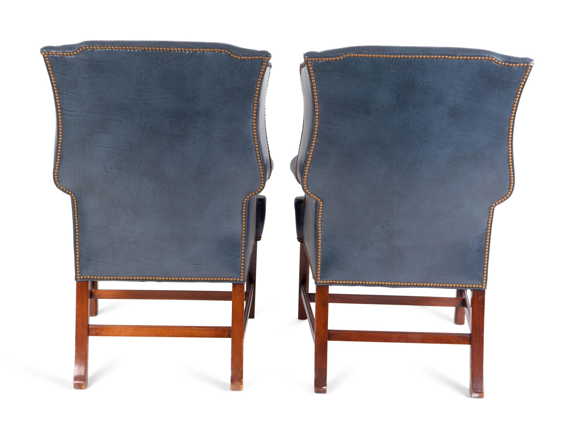 A Pair of George II Style Leather Upholstered Wingback Chairs — 19TH CENTURY