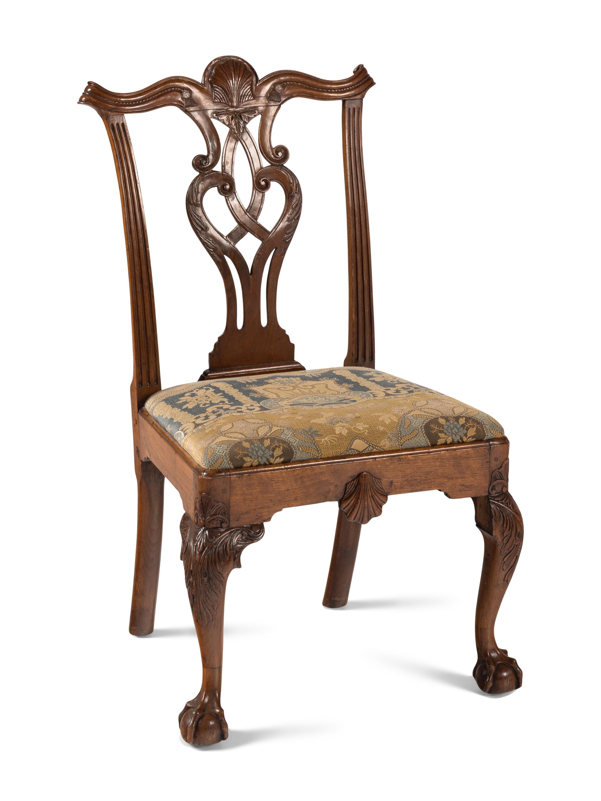 A Group of Four Chippendale Carved Walnut Side Chairs