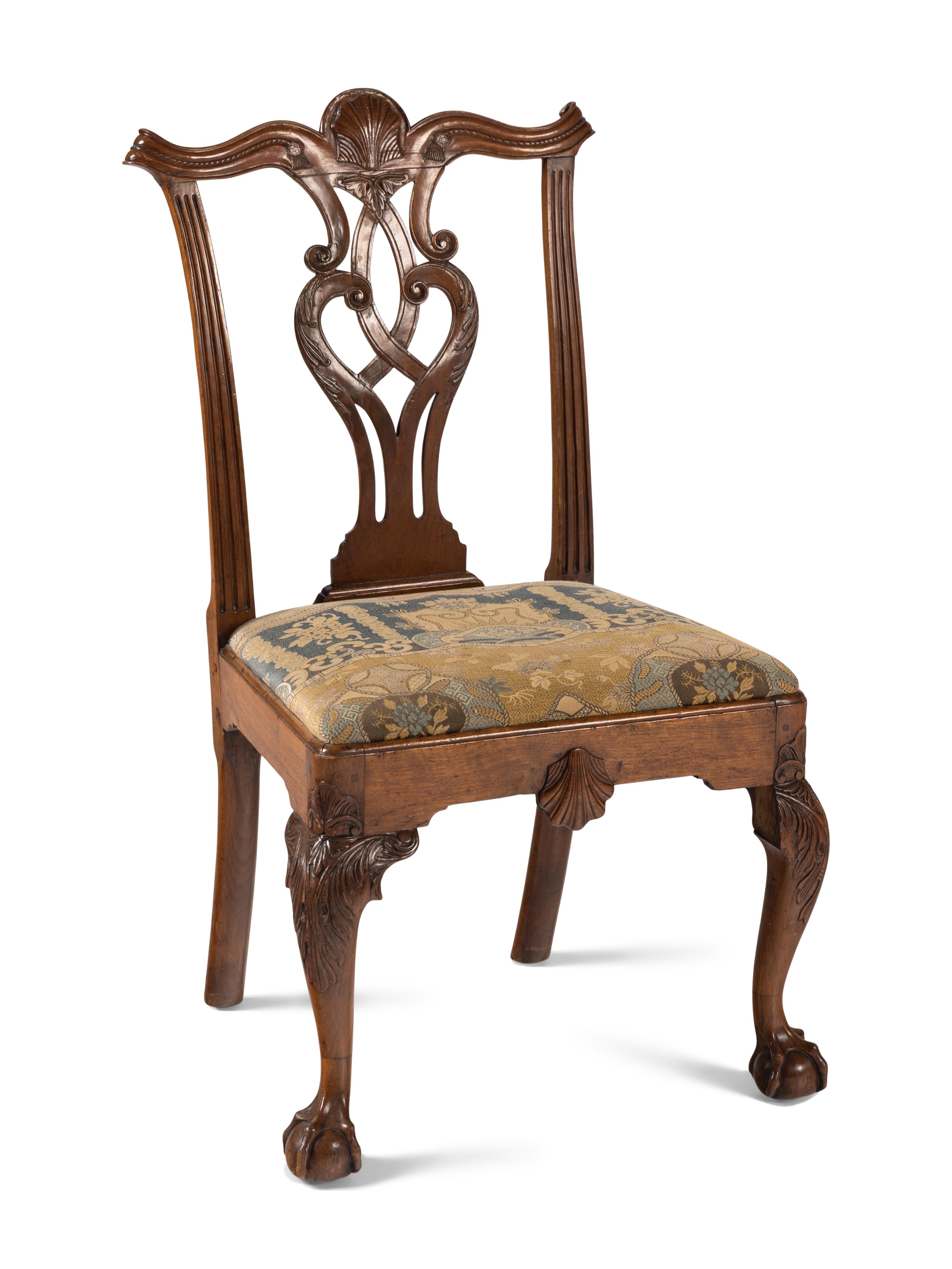 A Group of Four Chippendale Carved Walnut Side Chairs