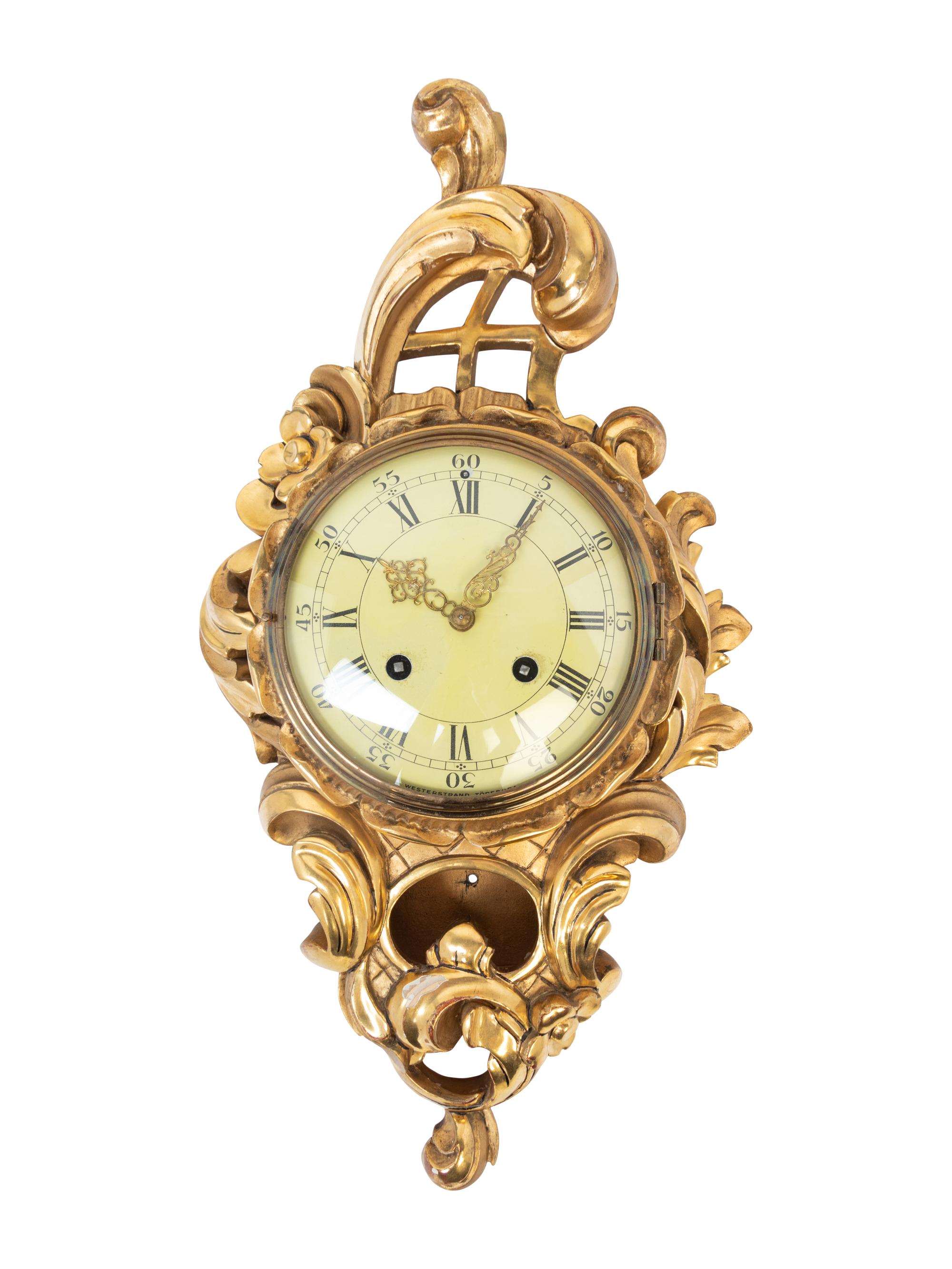A Rococo Style Giltwood Cartel Clock