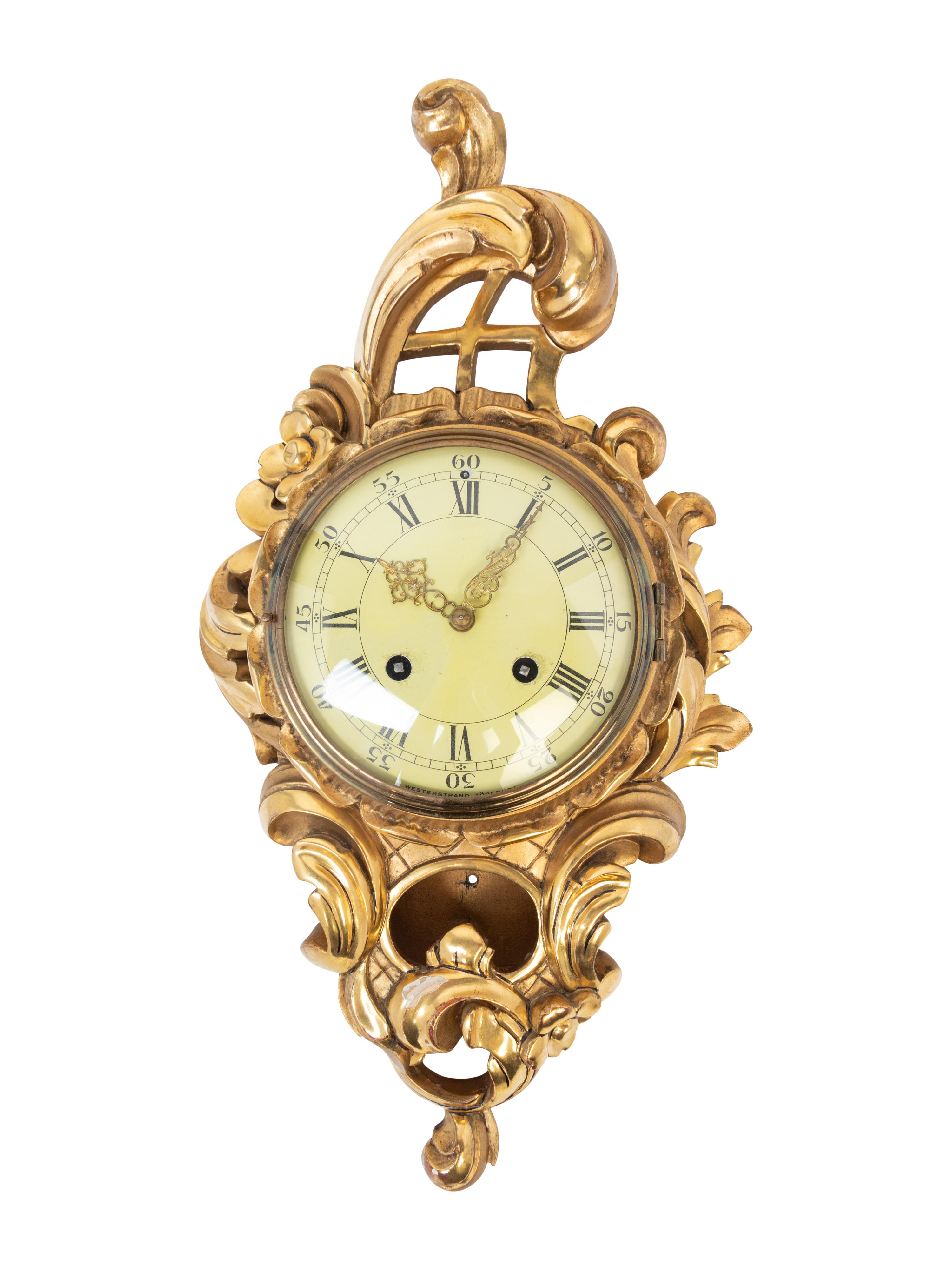 A Rococo Style Giltwood Cartel Clock
