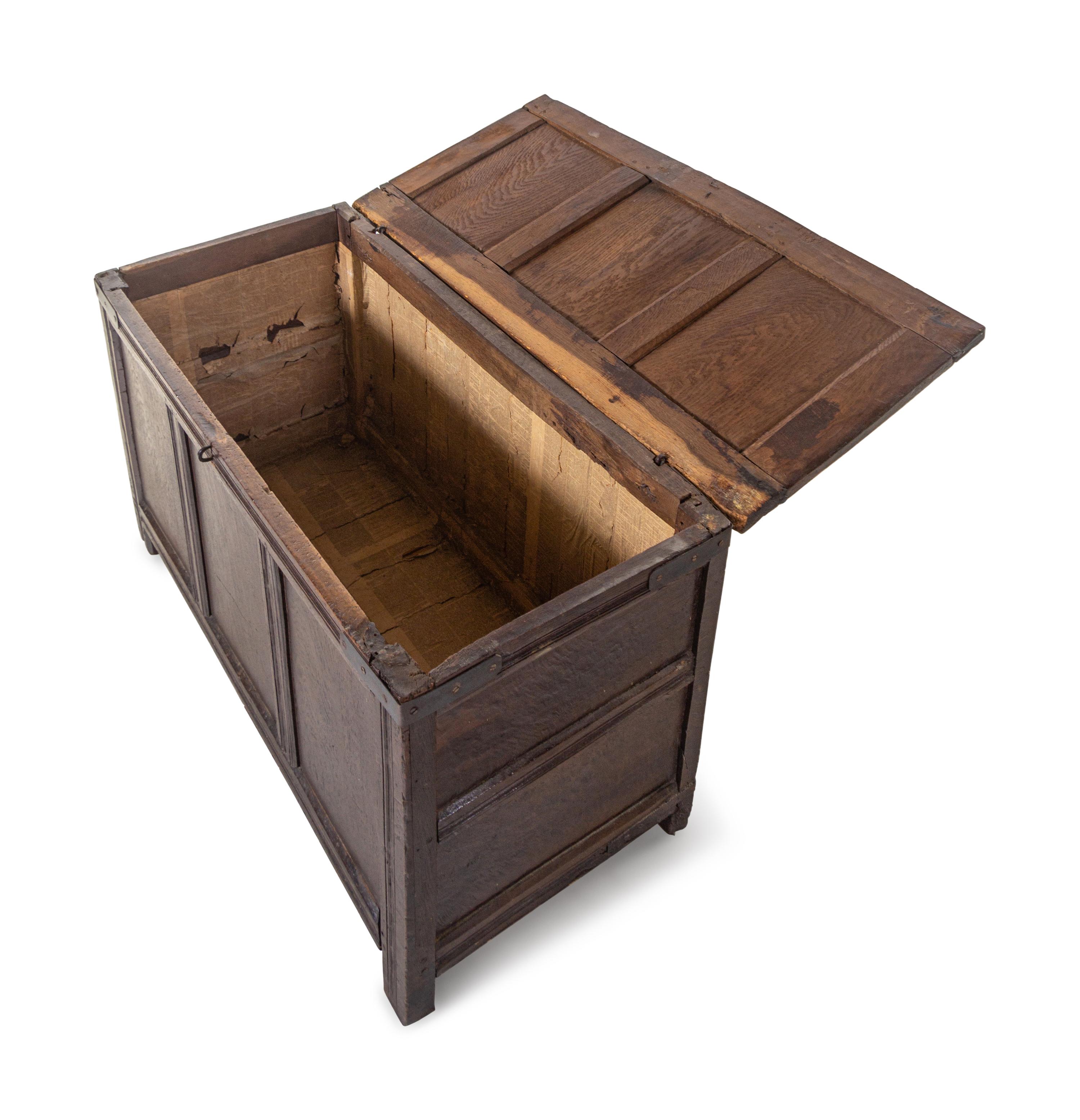 A Jacobean Iron Mounted Molded and Paneled Oak Storage Chest