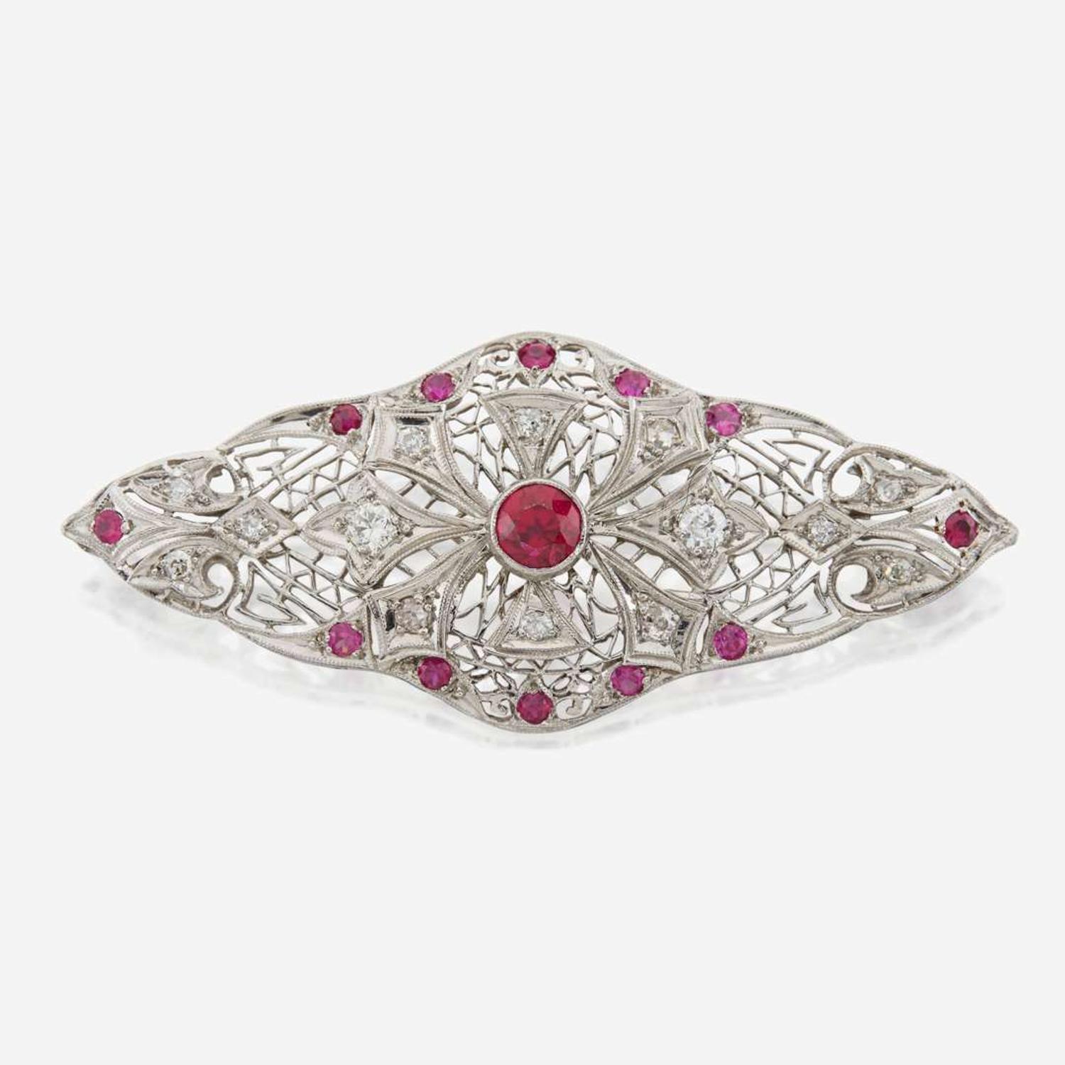 A platinum, diamond, and ruby brooch