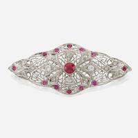 A platinum, diamond, and ruby brooch