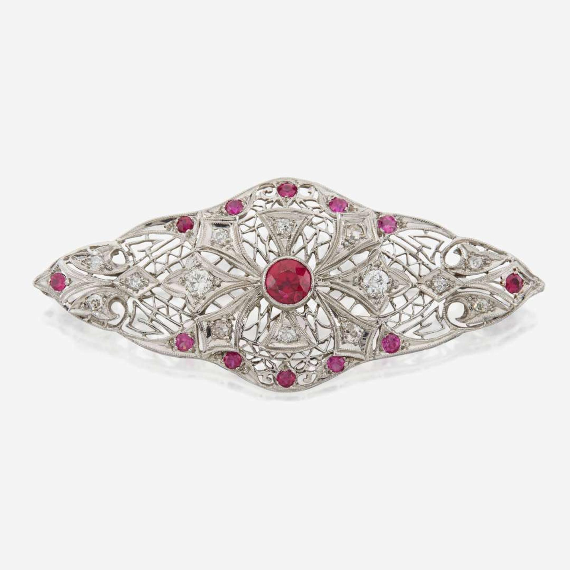 A platinum, diamond, and ruby brooch