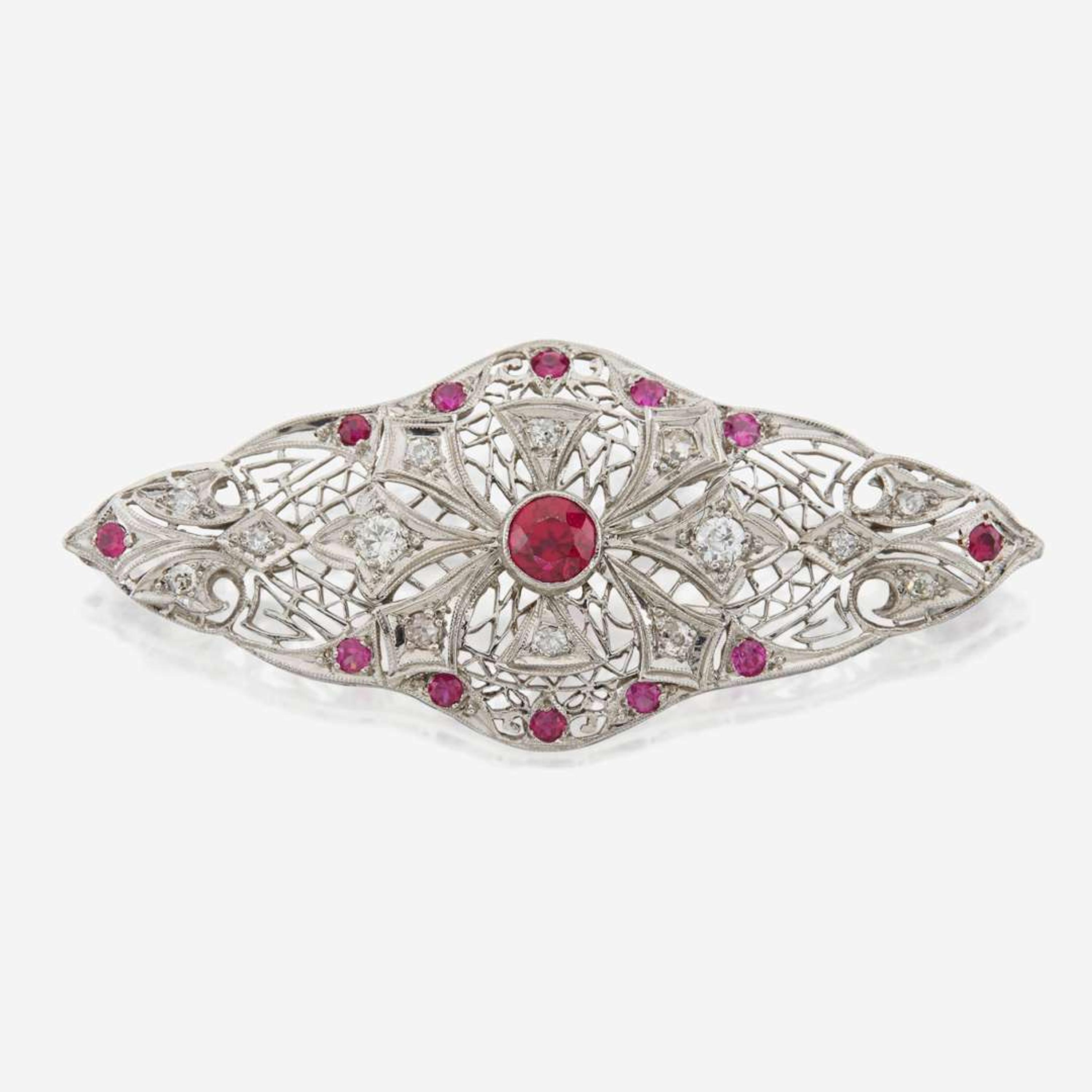 A platinum, diamond, and ruby brooch