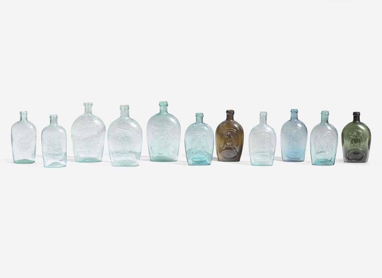 A collection of eleven mold-blown colored glass flasks, various makers, 19th century
