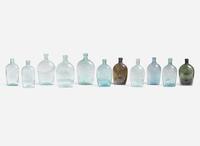 A collection of eleven mold-blown colored glass flasks, various makers, 19th century