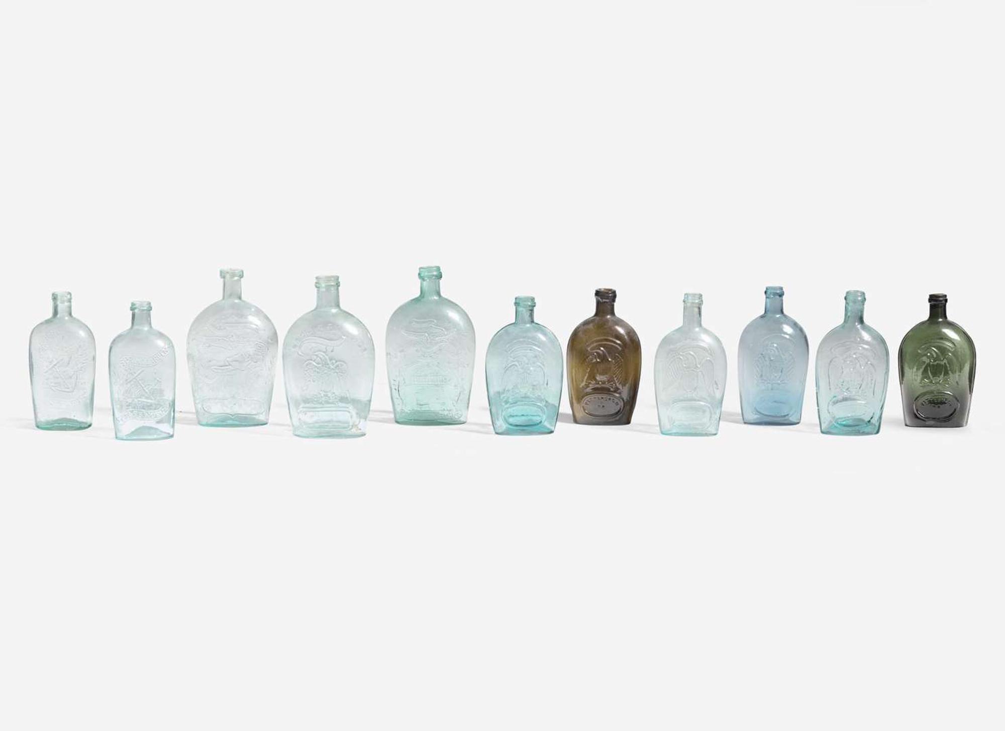 A collection of eleven mold-blown colored glass flasks, various makers, 19th century