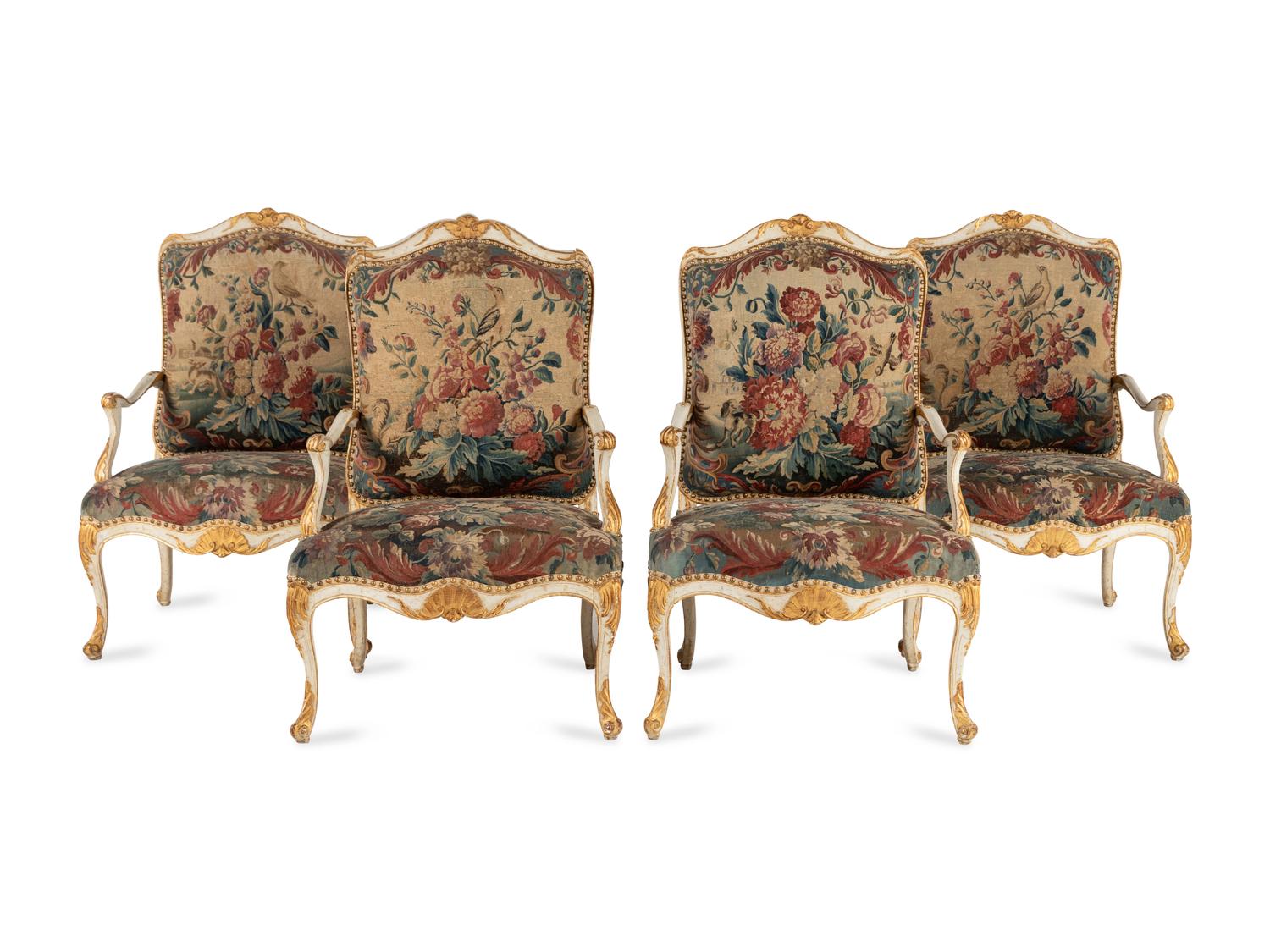 A Set of Four Louis XV White-Painted and Parcel Gilt Tapestry-Upholstered Fauteuils