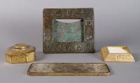 A Tiffany Studios Partial Bronze Desk Set, Zodiac, Width of widest 10 inches.