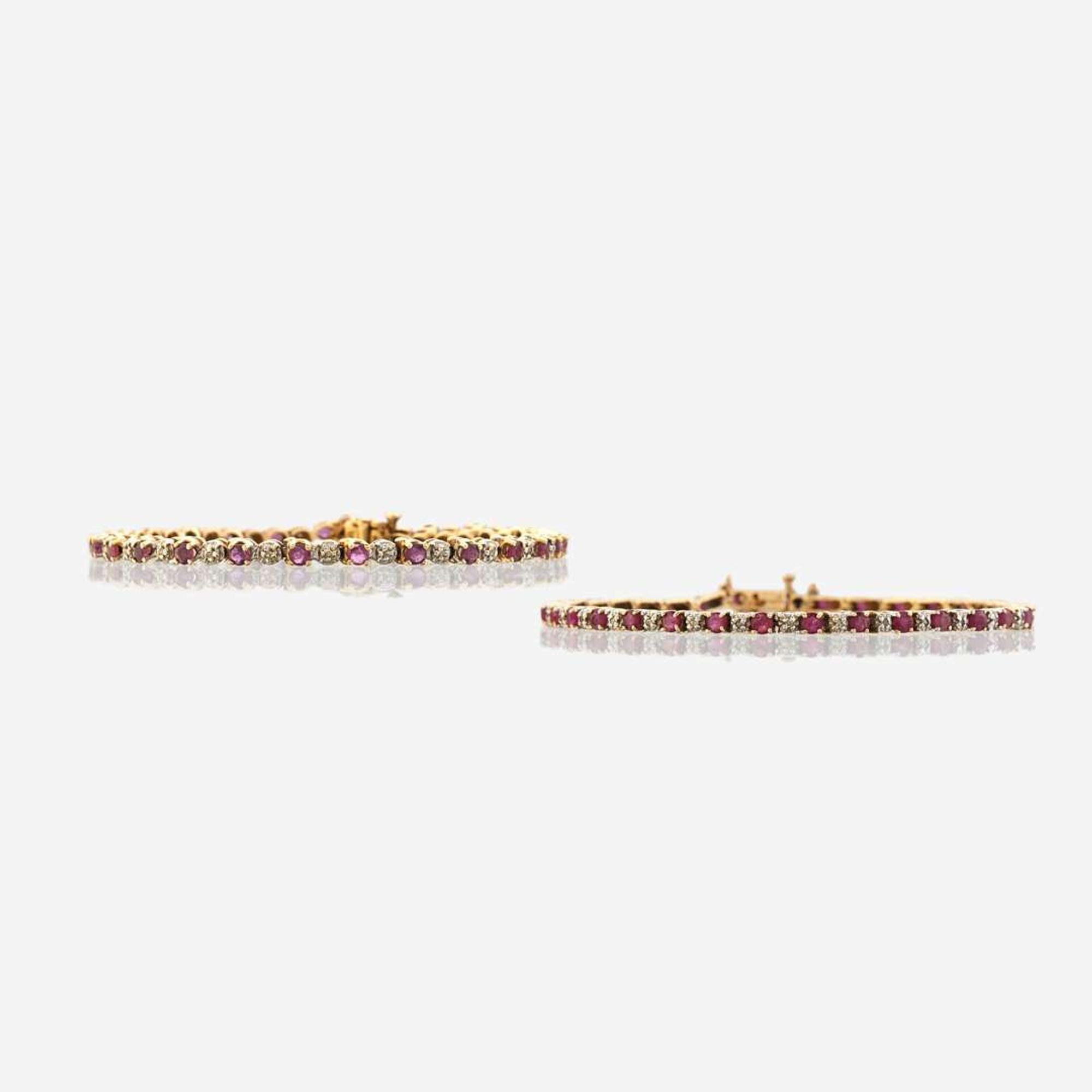 A pair of ruby, diamond, and gold bracelets
