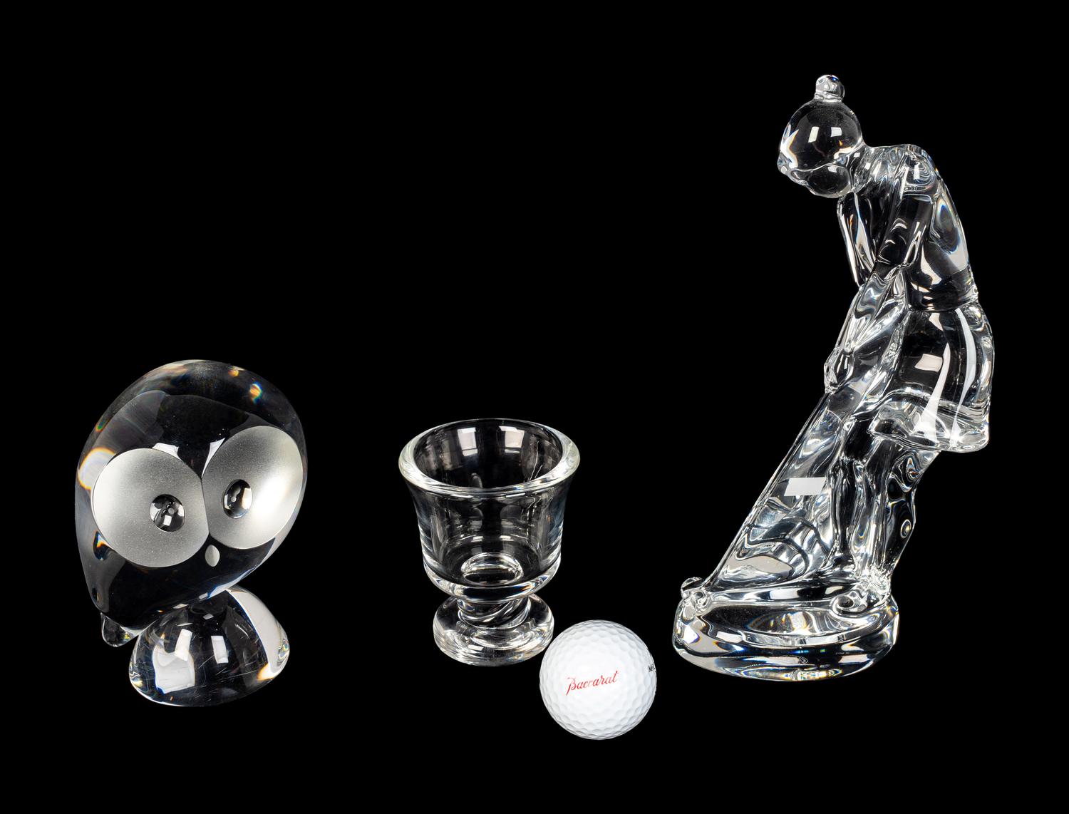 A Baccarat Figure of a Female Golfer, a Spaulding Baccarat Golf Ball, a Steuben Toothpick Holder and a Steuben Owl