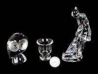A Baccarat Figure of a Female Golfer, a Spaulding Baccarat Golf Ball, a Steuben Toothpick Holder and a Steuben Owl