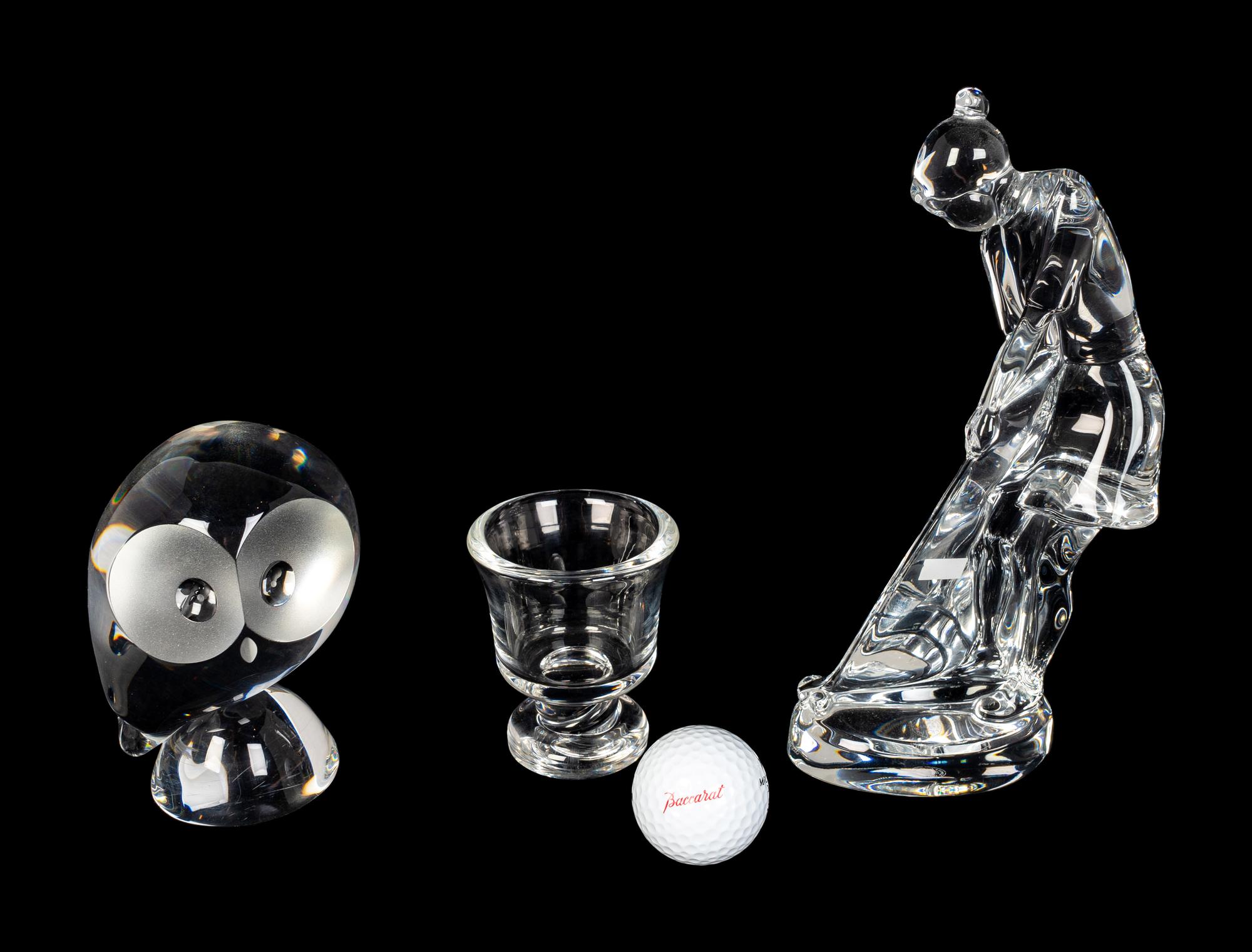 A Baccarat Figure of a Female Golfer, a Spaulding Baccarat Golf Ball, a Steuben Toothpick Holder and a Steuben Owl
