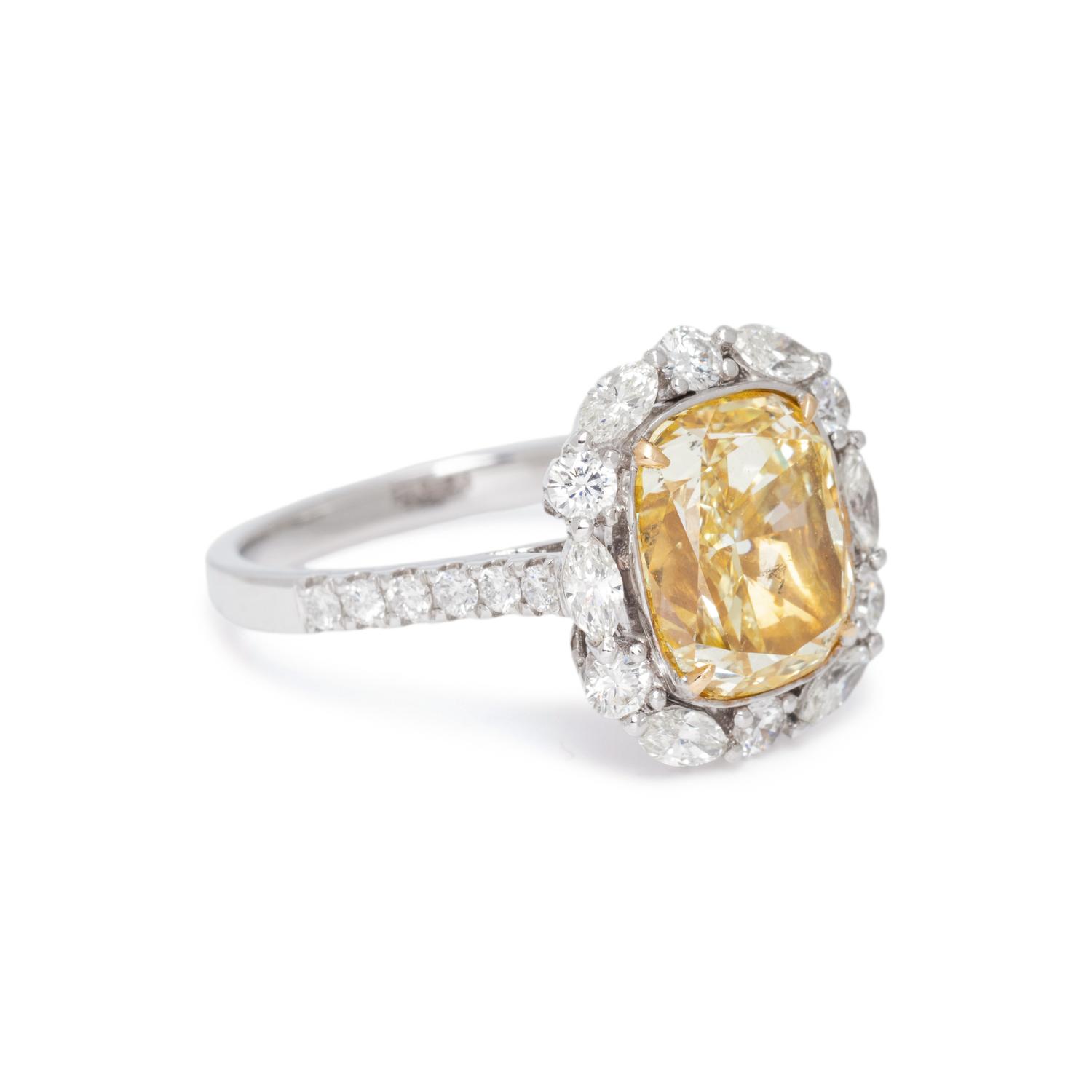 FANCY YELLOW DIAMOND AND DIAMOND RING