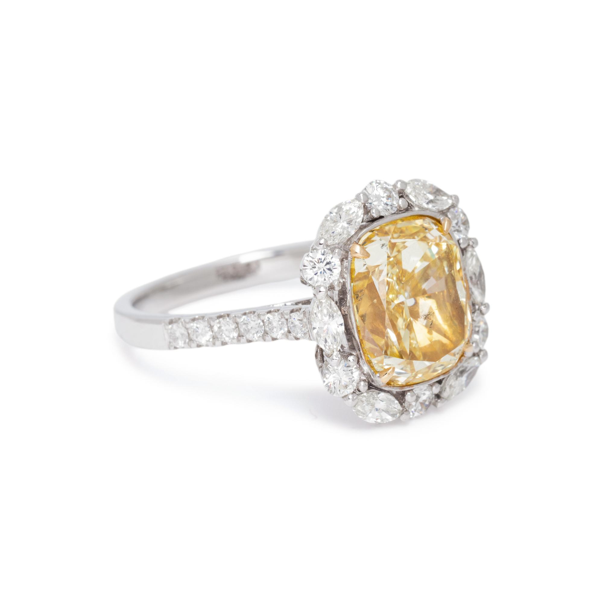 FANCY YELLOW DIAMOND AND DIAMOND RING