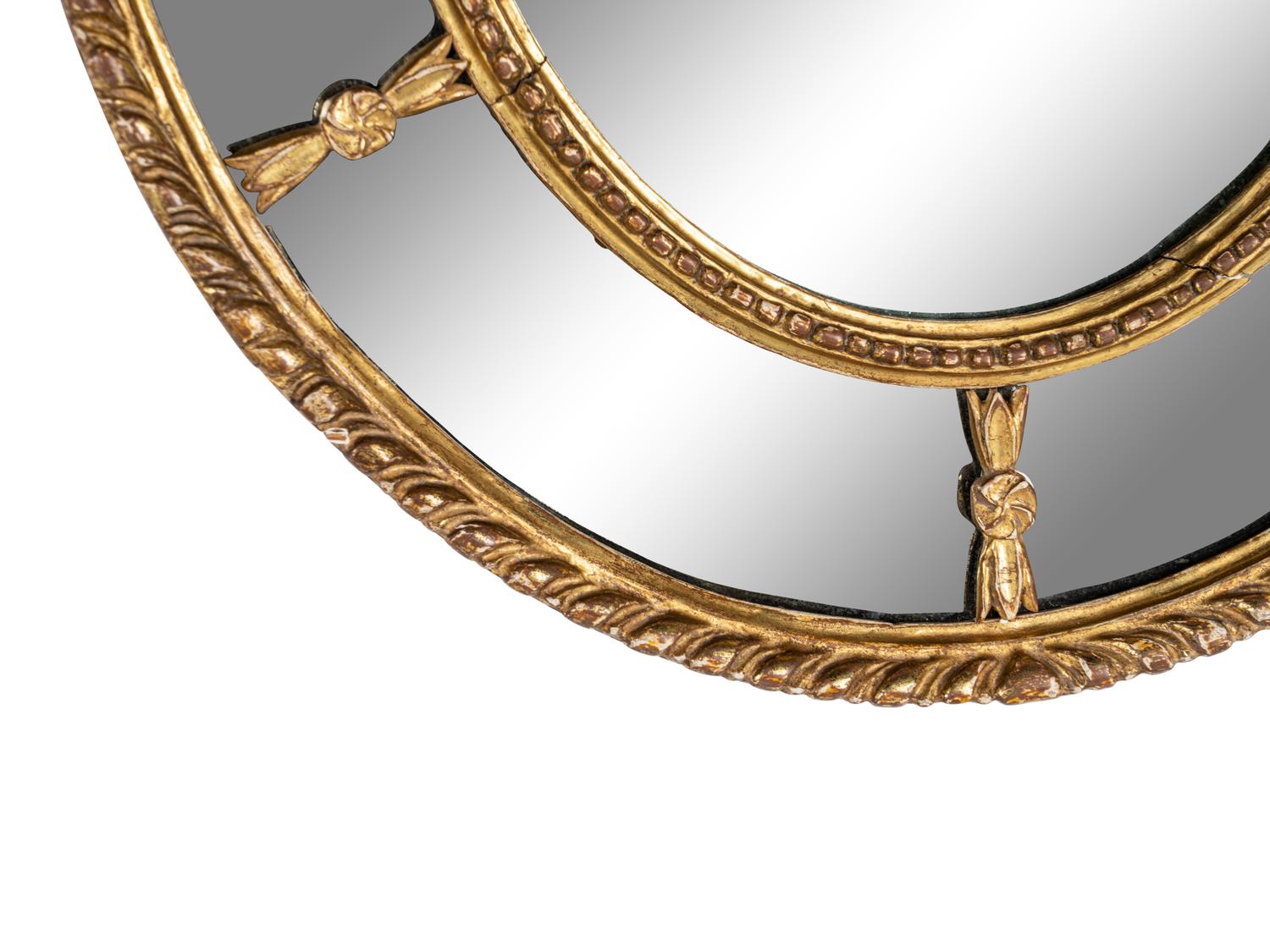 A Near Pair of George III Giltwood Oval Mirrors