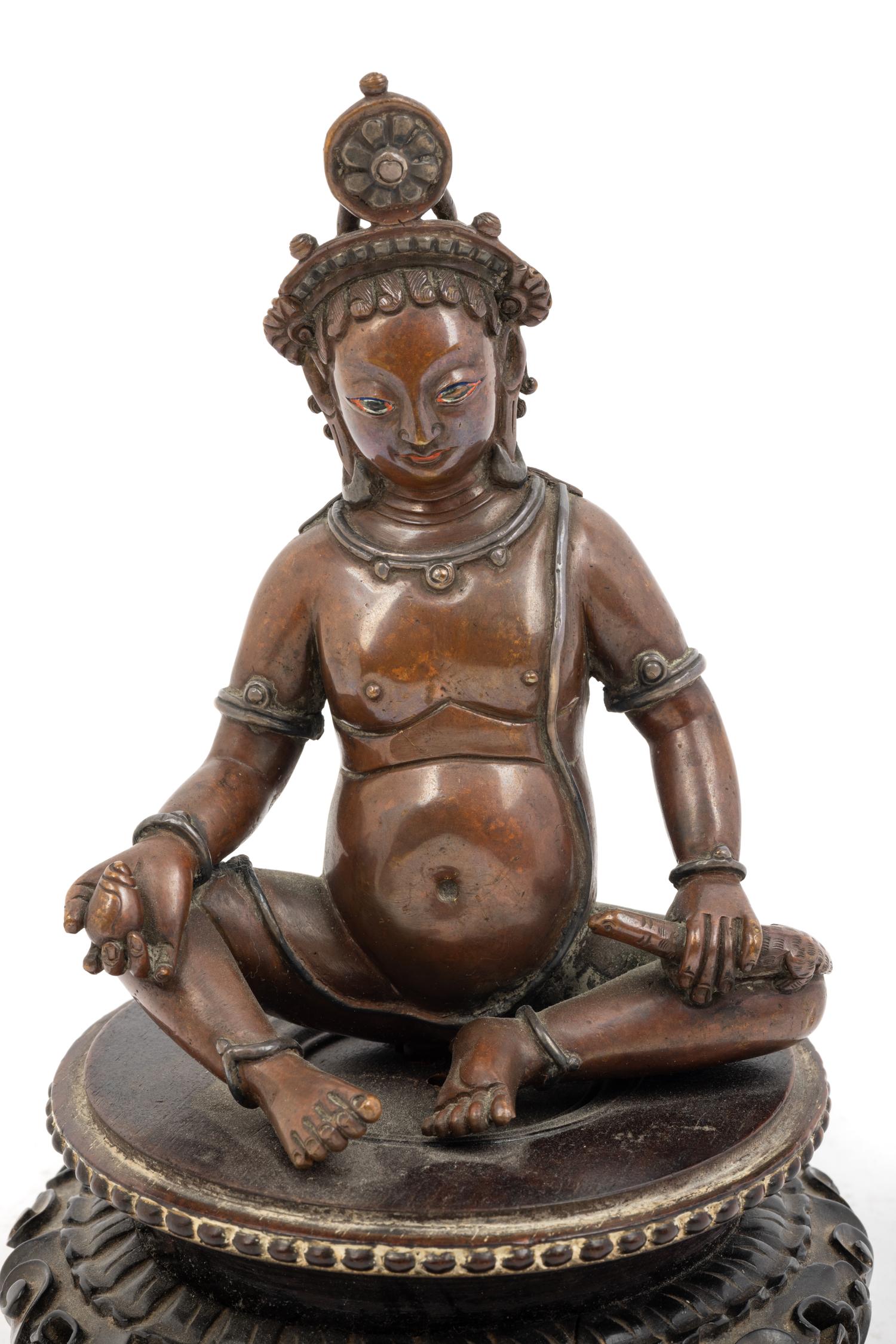 A Nepalese Bronze and Silver Figure of Seated Kubera