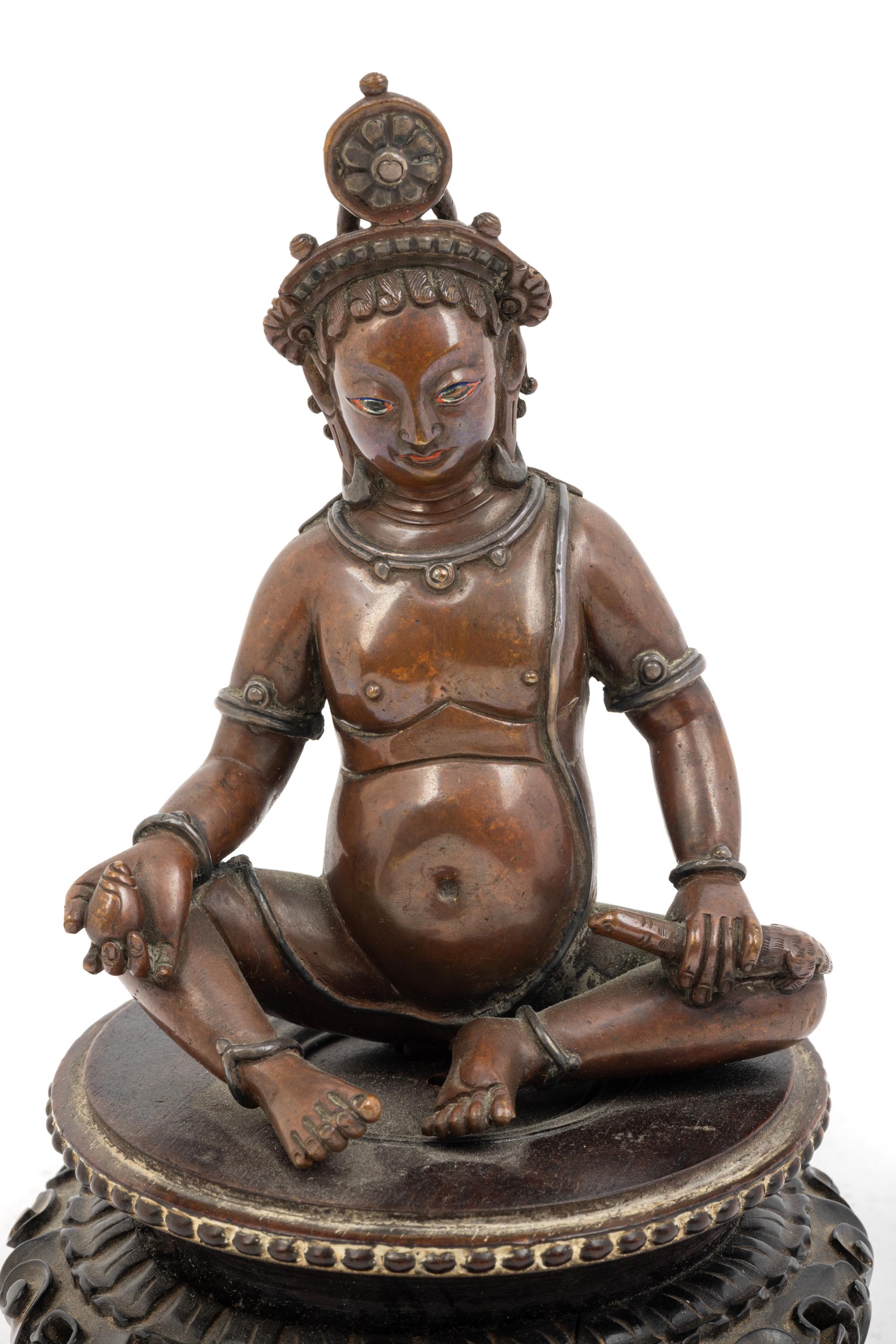 A Nepalese Bronze and Silver Figure of Seated Kubera