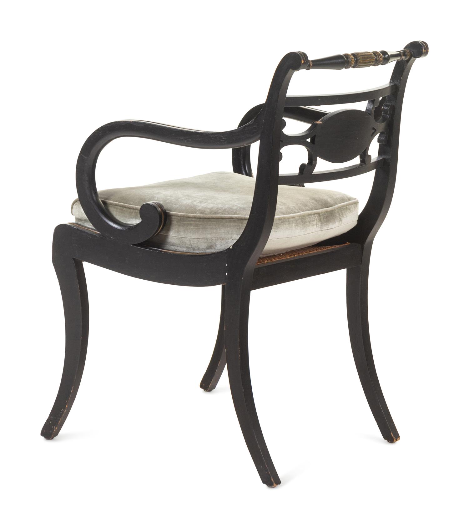A Regency Painted and Parcel-Gilt Cane Seat Armchair