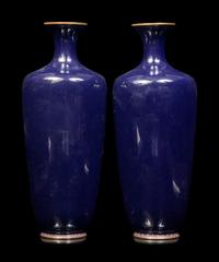 A Pair of Black Ground Cloisonné Vases and A Black Ground Polychrome Enameled Porcelain Charger