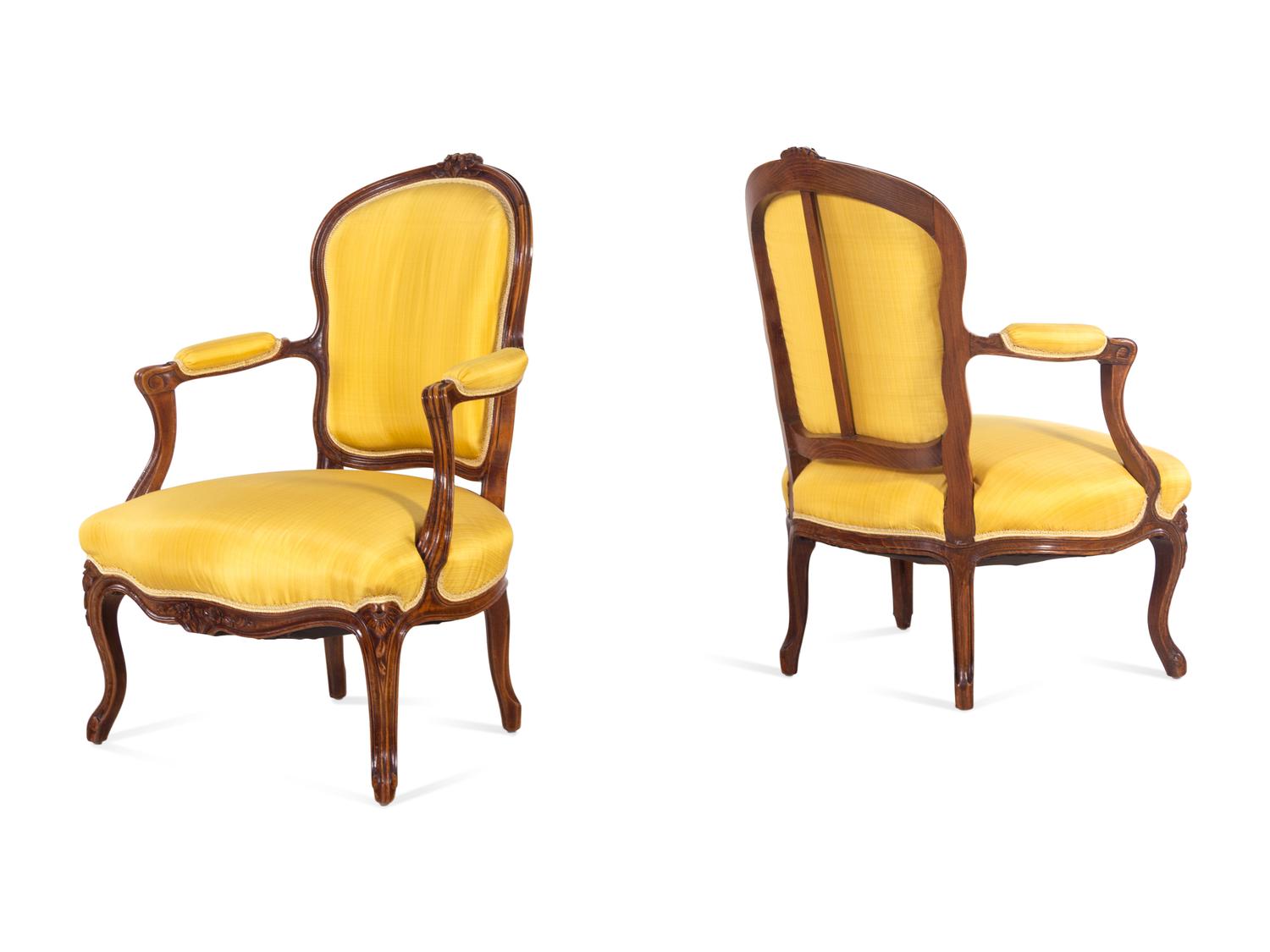 A Set of Four Louis XV Style Walnut Fauteuils