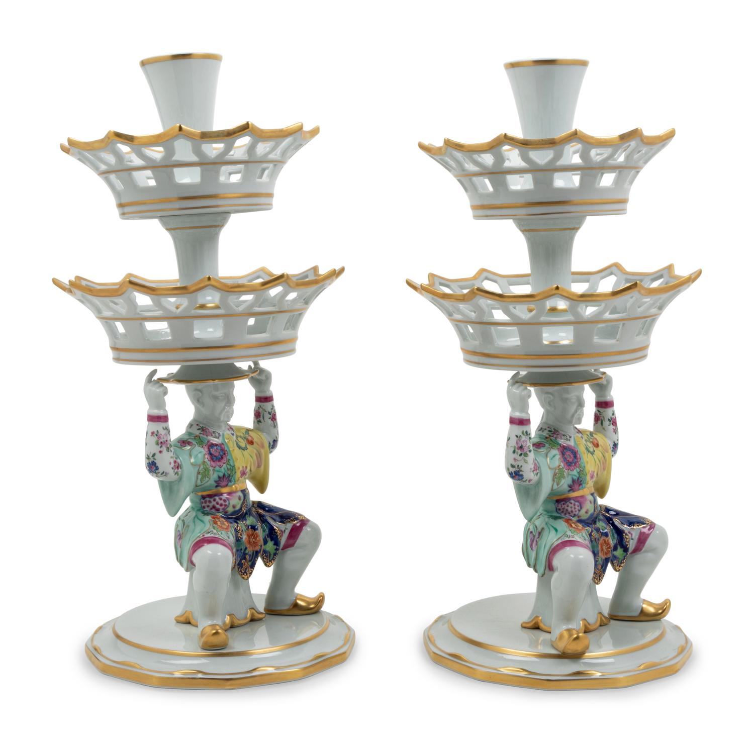 A Pair of Mottahedeh Parcel Gilt Tobacco Leaf Decorated Porcelain Figural Epergne