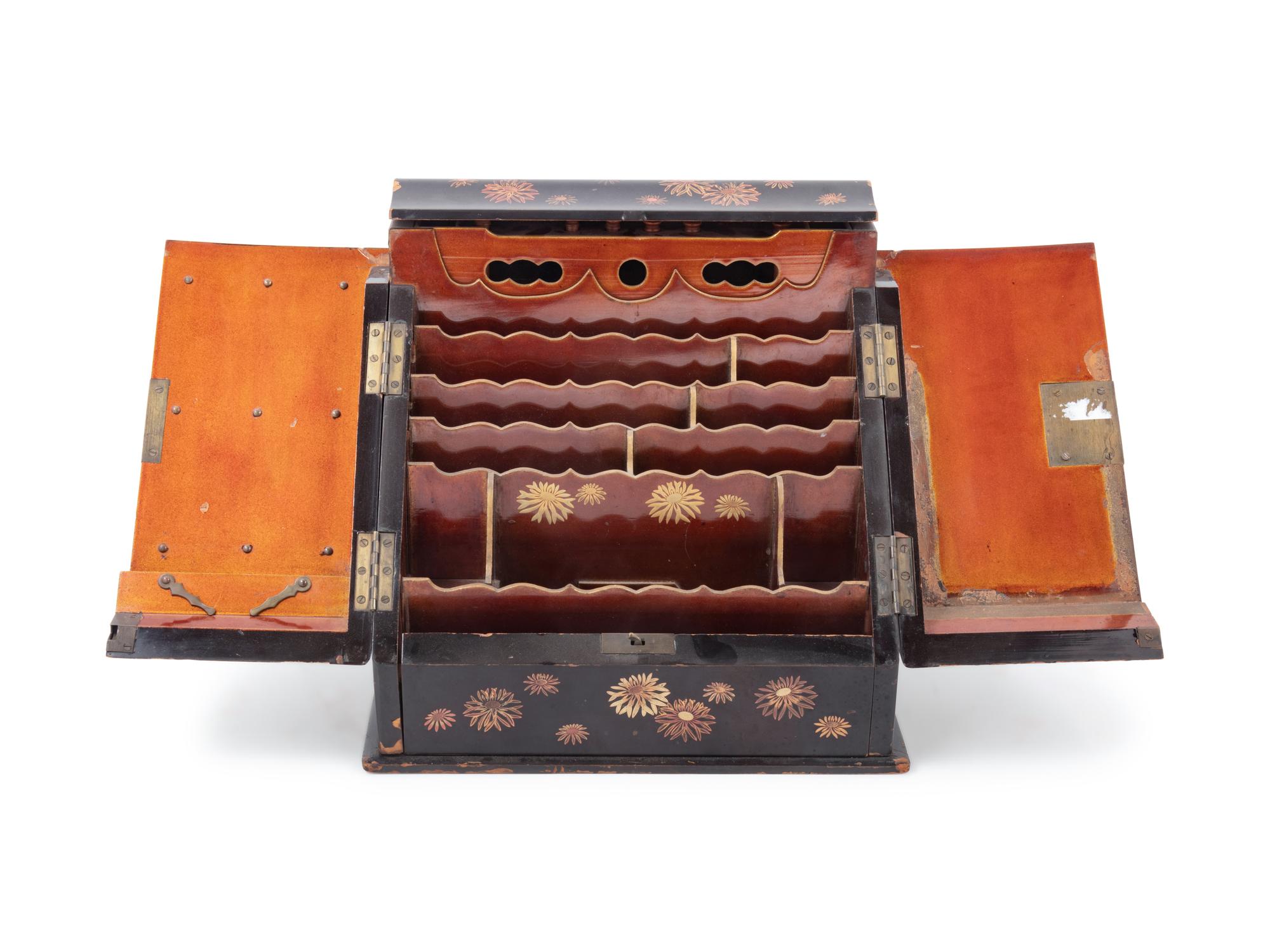 A Japanese Gilt, Black and Red Lacquered Stationary Chest