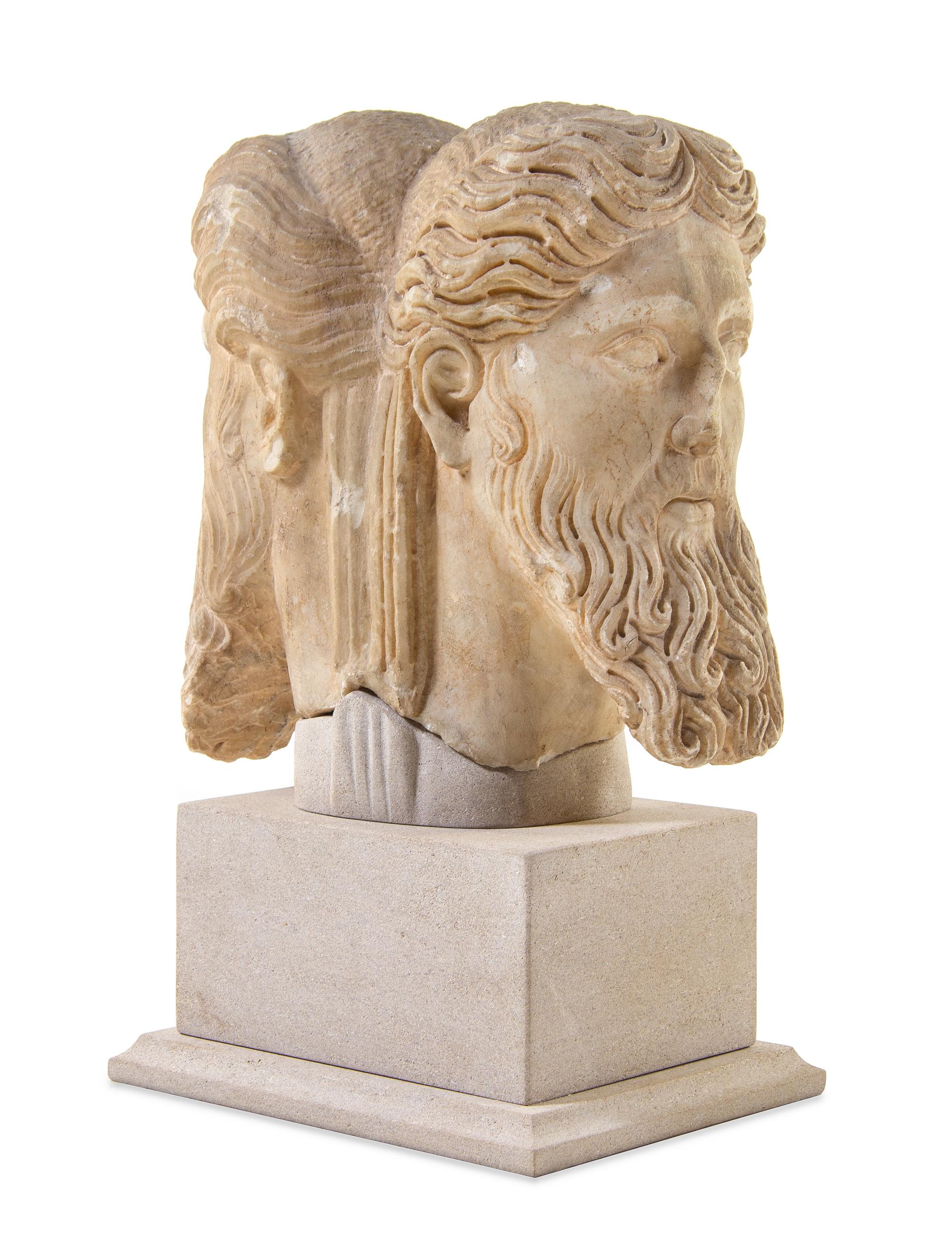 A Roman Marble Janiform Herm Head Height 13 1/2 inches. — CIRCA LATE 1ST-EARLY 2ND CENTURY C.E.