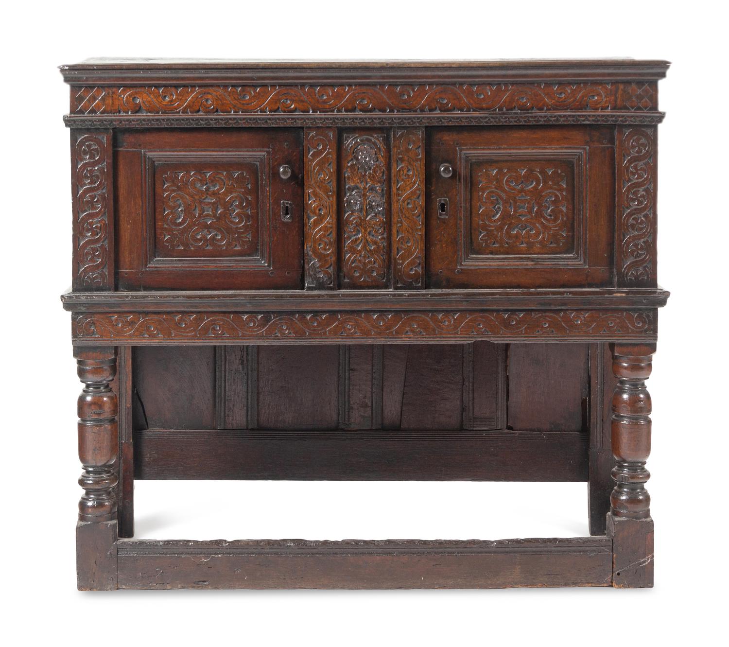 A Jacobean Carved Oak Court Cupboard