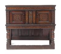 A Jacobean Carved Oak Court Cupboard