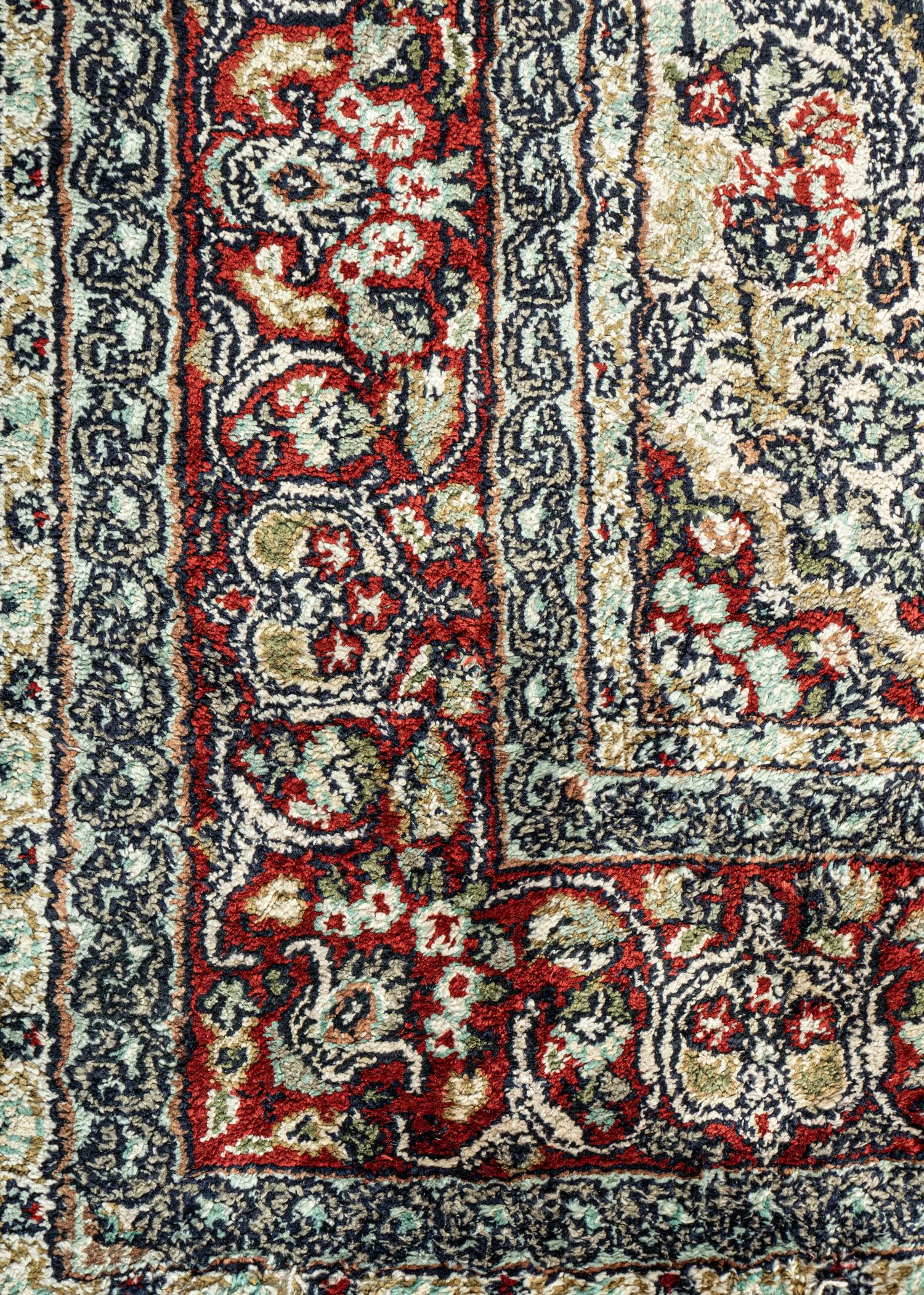 A Silk Tabriz Rug