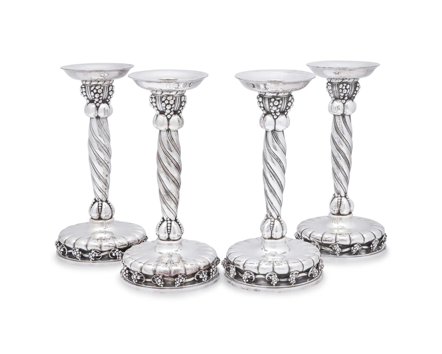 A Set of Four Georg Jensen Grapevine Silver Candlesticks