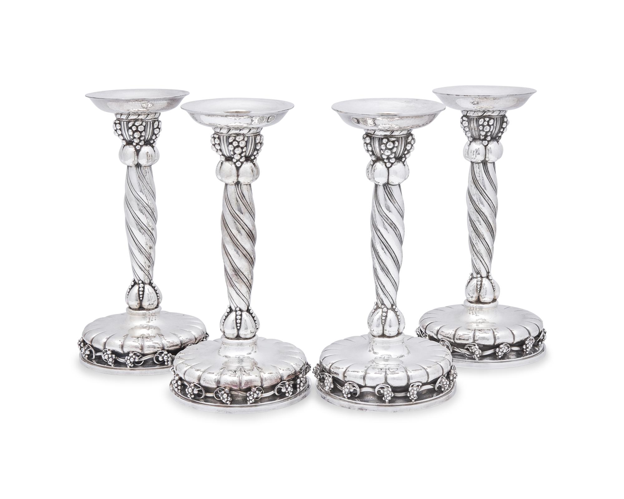 A Set of Four Georg Jensen Grapevine Silver Candlesticks