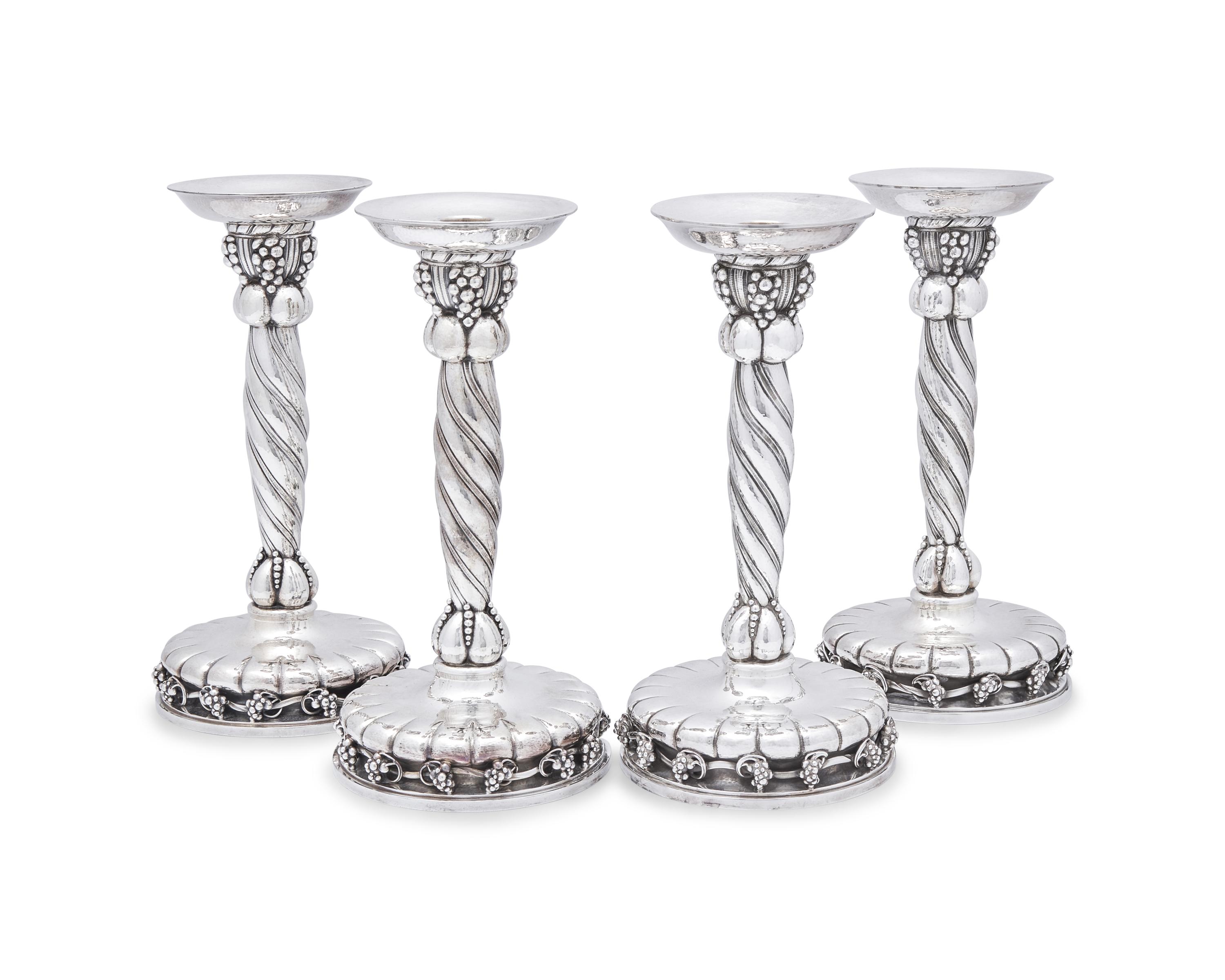 A Set of Four Georg Jensen Grapevine Silver Candlesticks