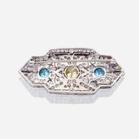 A yellow diamond, diamond, zircon, and fourteen karat white gold pendant/brooch, Raymond Yard
